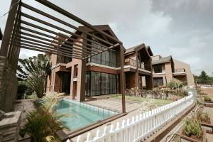 an image of a house with a swimming pool at Woods Luxury Villas in Lonavala