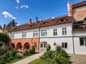 a row of houses in the medieval town of genoa at Mozart & Bach Historic Apartment in Sibiu