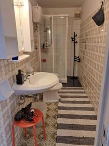 a bathroom with a sink and a toilet and a shower at La Fantesca in Pettorano sul Gizio +58 photos