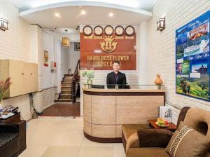 a man sitting at a bar in a lobby at Van Hoa Boutique Hotel in Hanoi