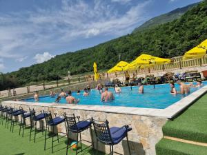 a group of people in the swimming pool at a resort at Rafting centar RT in Foča