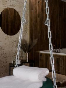a towel swing in a bathroom with a mirror at Zámoček Mraznica in Prievidza