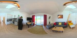 a living room with a couch and a table at Ferienwohnung Döller in Gmünd