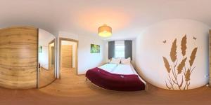 a bedroom with a bed in a round room at Ferienwohnung Döller in Gmünd