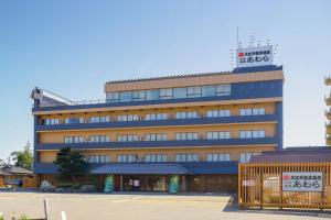a building with a sign on top of it at Ooedo Onsen Monogatari Awara in Awara