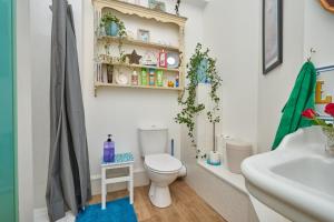 a bathroom with a toilet and a sink at Enjoy Sandown 1 in Sandown +34 photos