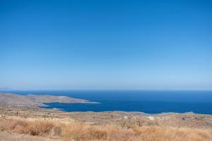 a view of the ocean from the top of a hill at Ayelma - Kythnos Villa in Kithnos