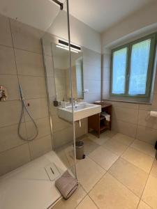 a bathroom with a sink and a shower at Podere Le Marene in Scoppieto +91 photos