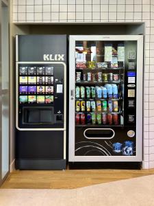 a kkk refrigerator with its door open in a store at ibis budget Cholet Centre in Cholet