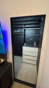 a room with a closet with a dresser and a mirror at Parenzana Apartment in Portorož