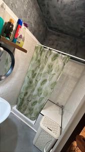 a bath tub with a green cushion on a counter at Parenzana Apartment in Portorož