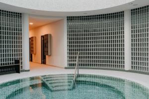 a pool in the middle of a building at Červený Mlýn in Tišnov +17 photos