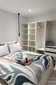 a bedroom with a bed with a stuffed animal on it at BeachVibe in Puerto Naos