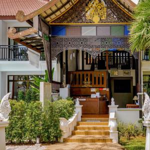 a house with a staircase leading to a church at Radateeree Boutique Resort in Chiang Mai