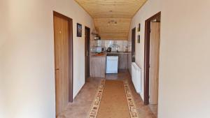 a room with a kitchen and a hallway at Penzion Mirabel in Bešeňová