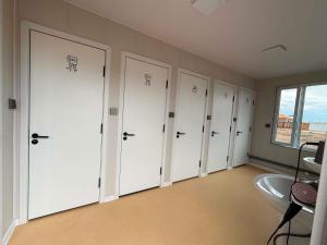 a row of lockers in a room with a window at Gobi Desert Guesthouse & Tours in Dalandzadgad +10 photos