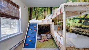a bunk bed in a room with a mural at Peak Pine by AvantStay in Albrightsville