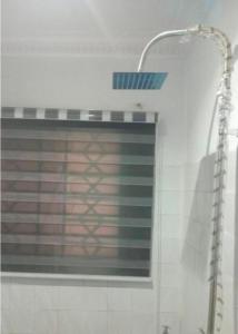 a street light on the side of a building at Monarch Apartment in Oshogbo +32 photos