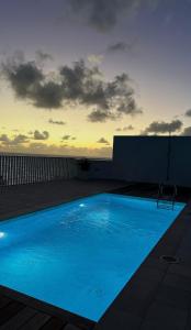 a large blue swimming pool on top of a building at BeachVibe in Puerto Naos +16 photos