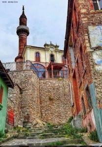 a building with a tower on top of it at Small House in İzmir