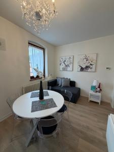 a living room with a table and a couch at Sottocastello 1 in Gorizia