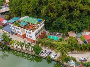 an aerial view of a house with a swimming pool at Catba Backpackers - Sea Vibe Pool Bar & Bungalow in Cat Ba