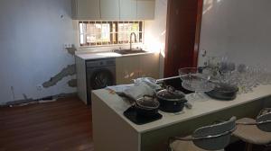 a kitchen with some pots and pans on a counter at Pati place in Mememo