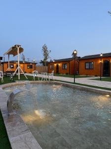 a swimming pool in the middle of a yard at Some Hotel Antakya in Hatay