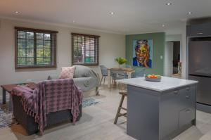 a kitchen and living room with a couch and a table at Gardenview Sedgefield in Sedgefield +14 photos
