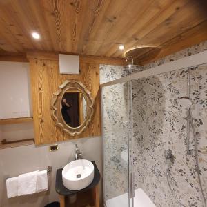 a bathroom with a sink and a shower at Villa Martha Vintage Hotel-B&B in Santa Cristina Gherdëina +98 photos