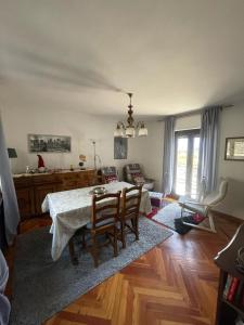 a dining room with a table and chairs in a room at A Casa di Zio Zeffy in Châtillon
