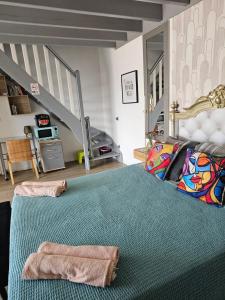 a bedroom with a large bed with two towels on it at les 2 dauphins in Le Barcarès +48 photos