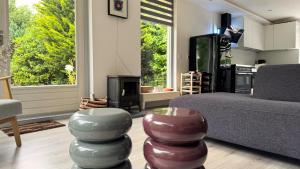 a living room with a couch and a tv at Huisje 47 | 8 persons in Gasselte +11 photos