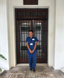 a man is standing in front of a door at The Manor 1926 in Colombo