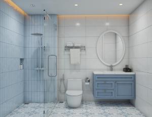 a bathroom with a toilet and a sink and a mirror at TTC Lotus Hotel in Phú Quốc +31 photos
