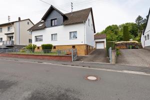 a white house on the side of a street at Landidylle – Nostalgie in Ortenberg