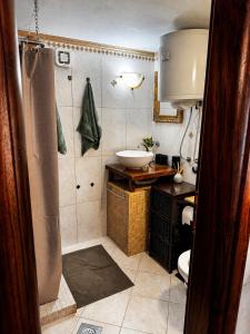a bathroom with a sink and a toilet and a shower at Biba Holiday in Omišalj +8 photos