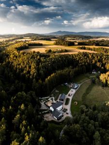 an aerial view of a house in the forest at Podhlavický mlýn in Všelibice