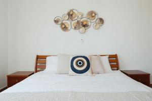 a bedroom with a bed with a target on the wall at Chloraka Sea View Apt with Pool in Khlorakas +33 photos