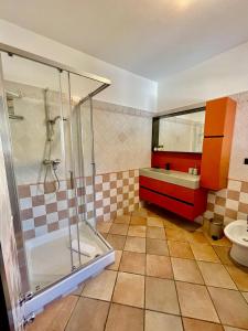 a bathroom with a shower and a sink at Sosta dei Passeggeri in Roccabruna