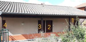 a house with a door with the on it at Hôtel de Cenves in Cenves