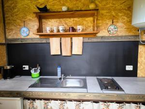 a kitchen with a sink and a counter top at Barn Suite in Valga