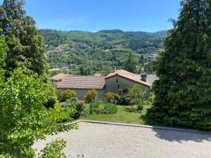 an image of a house in the middle of trees at Chambre d'hôtes de la Riaille 400 m de la dolce via in Le Cheylard