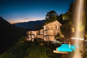 an exterior view of a building with a swimming pool at Enjoy nature Be energetic in Yunji