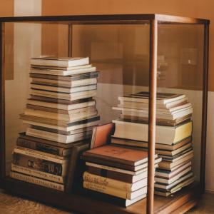 a stack of books stacked on top of each other at Mà C'a - Casa Privata in Praiano