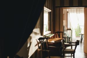 a dining room with a table and chairs and a window at Mà C'a - Casa Privata in Praiano +47 photos