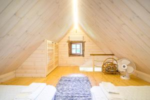 a attic room with a bed and a window at Reiu majake in Reiu