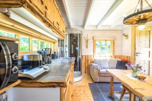 a kitchen and living room in a tiny house at Reiu majake in Reiu +25 photos
