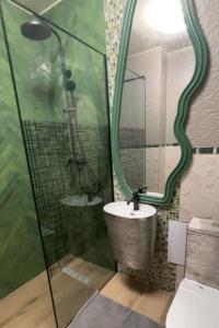 a bathroom with a sink and a mirror at GZP Residence Lugoj 5 in Lugoj