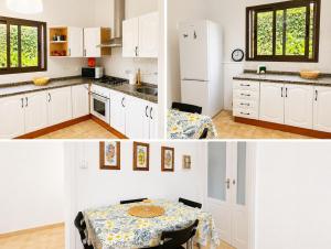 a kitchen with a table and a white refrigerator at Casa del Parque Tacoronte Centro in Tacoronte
